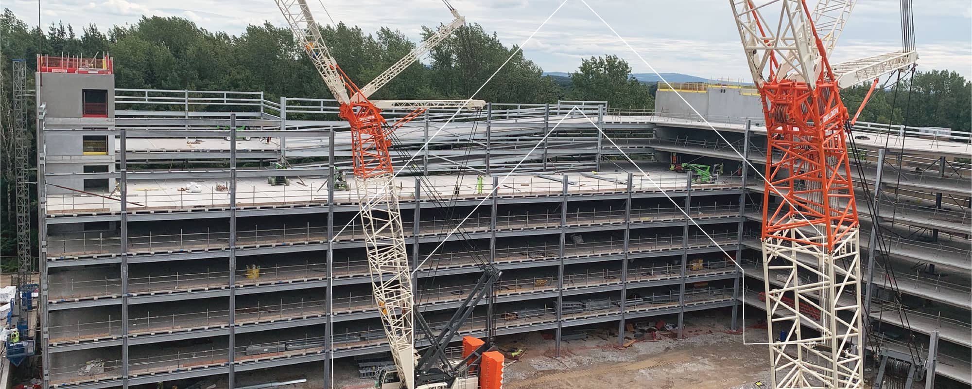 Cranes working on multi-storey car park in Manchester